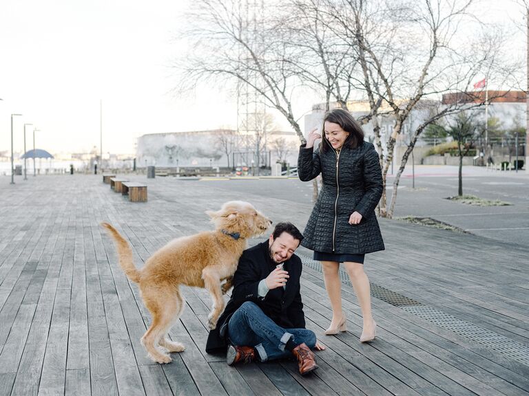 Funny candid moment between a couple and their dog.