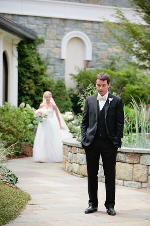 Groom in a Black Tuxedo and Yellow Bow Tie at First Look