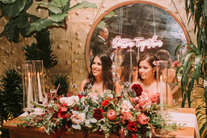 Rustic Sweetheart Table with Red Flower Arrangements