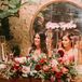 Rustic Sweetheart Table with Red Flower Arrangements