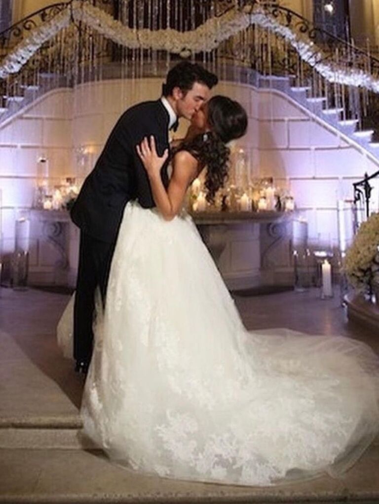 Kevin and Danielle Jonas kissing on their wedding day