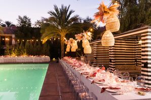 Poolside Reception With Long Tables, Rattan Lights and Pink Details at The Sands Hotel