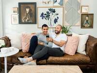 couple on couch planning wedding