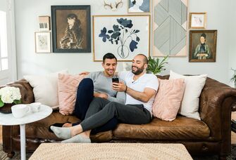 couple on couch planning wedding