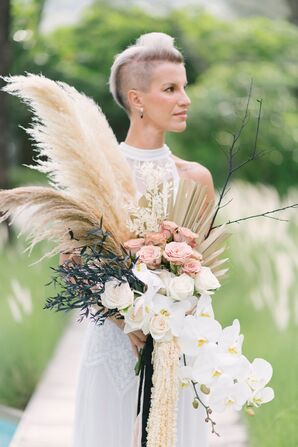 Bride Holding Modern Wedding Bouquet With Pampas Grass and Orchids
