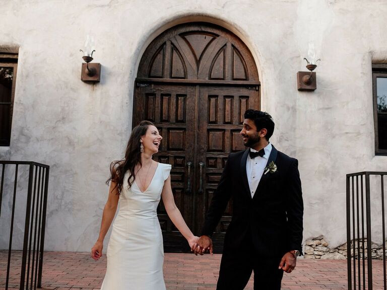 Couple holding hands and laughing