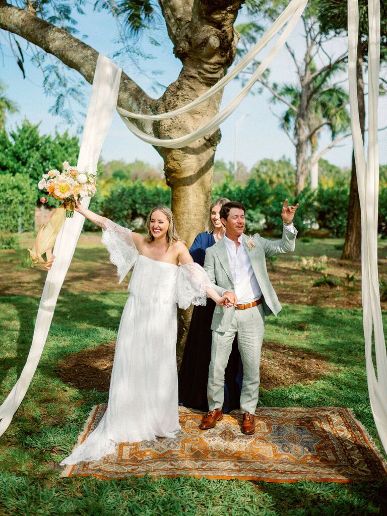 Fabric wedding arch at backyard wedding