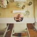 Instead of traditional chargers, the couple printed their engagement photos onto round place mats for each place setting.