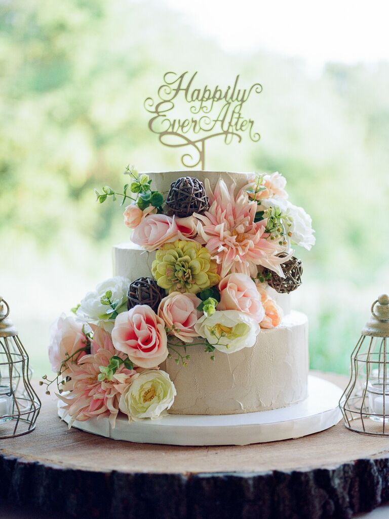 "Happily ever after" cake topper at fairytale-themed wedding