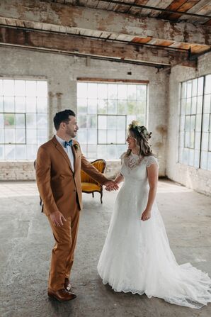 Groom in Orange Suit and Blue Bow Tie With Bride in Lace Wedding Dress and a Flower Crown