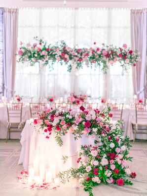 Romantic Pink Sweetheart Table with Cascading Rose Arrangement