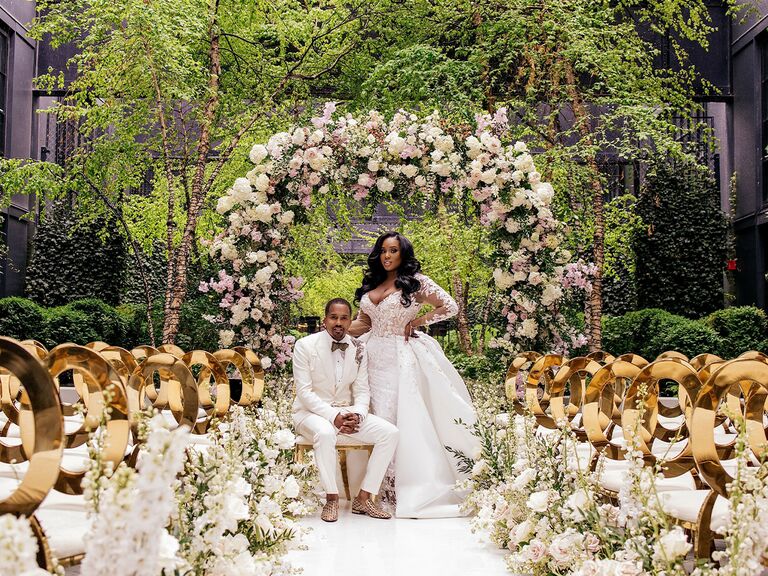 Lush floral decor at fairytale wedding ceremony