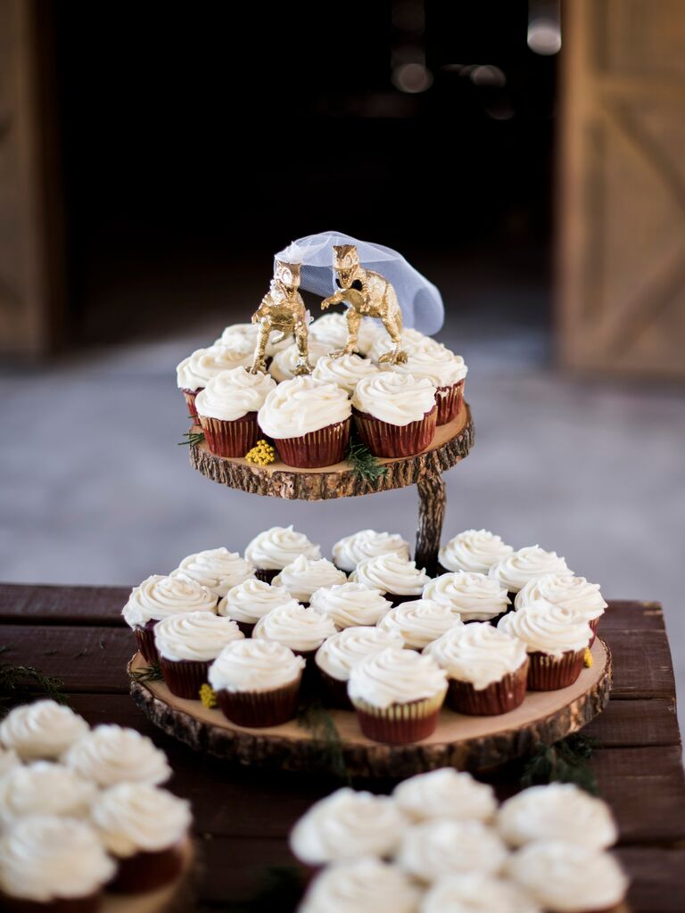 Golden T-Rex wedding cake toppers. 