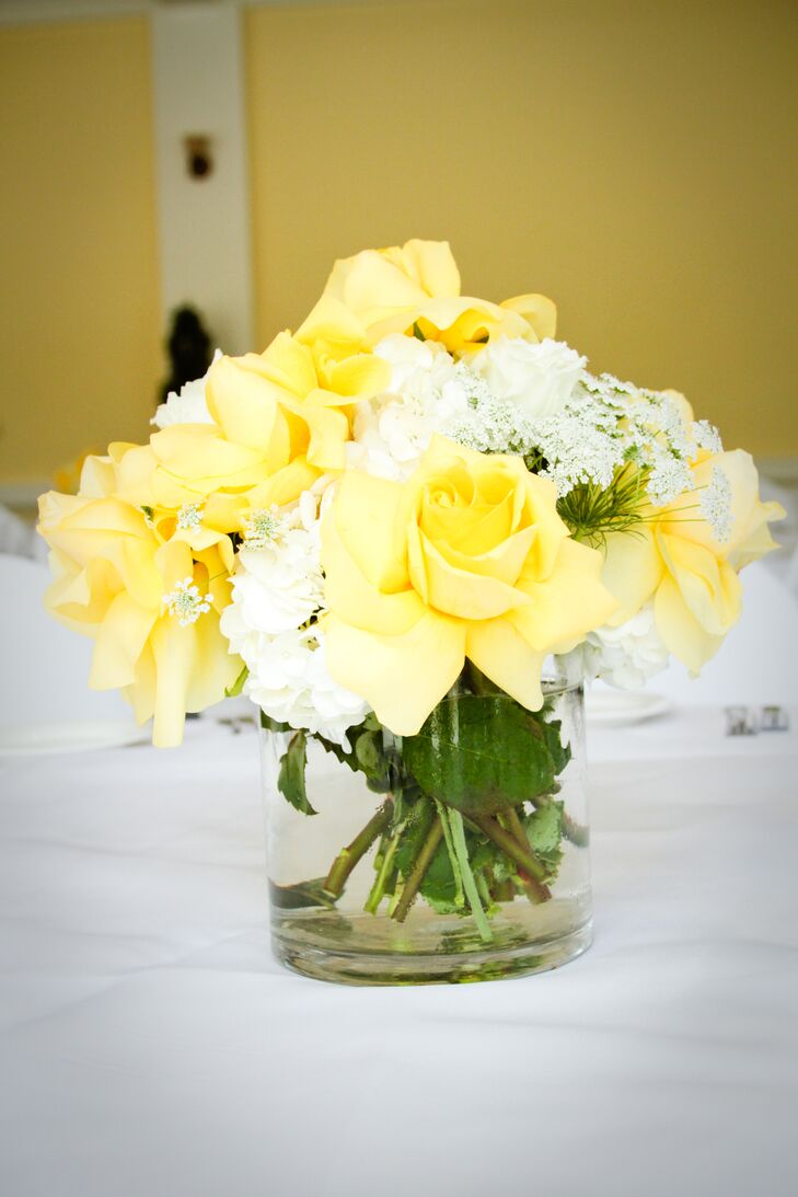 The reception took place inside the Lindley-Scott House, where guests were seated at dining tables with white tablecloths decorated with flower centerpieces. This particular arrangement had a mix of yellow roses, white hydrangeas and Queen Anne's lace.
