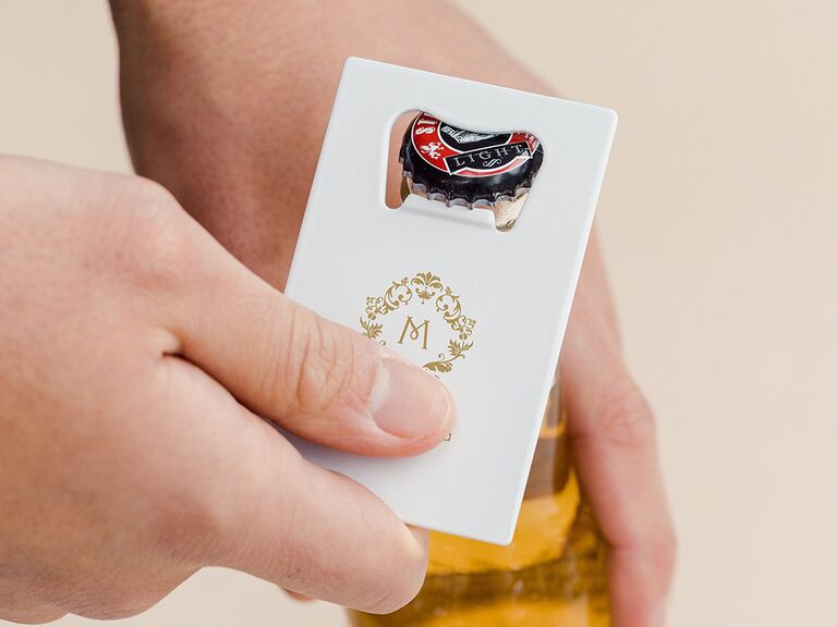 Bottle opener featuring a personalized initial. 