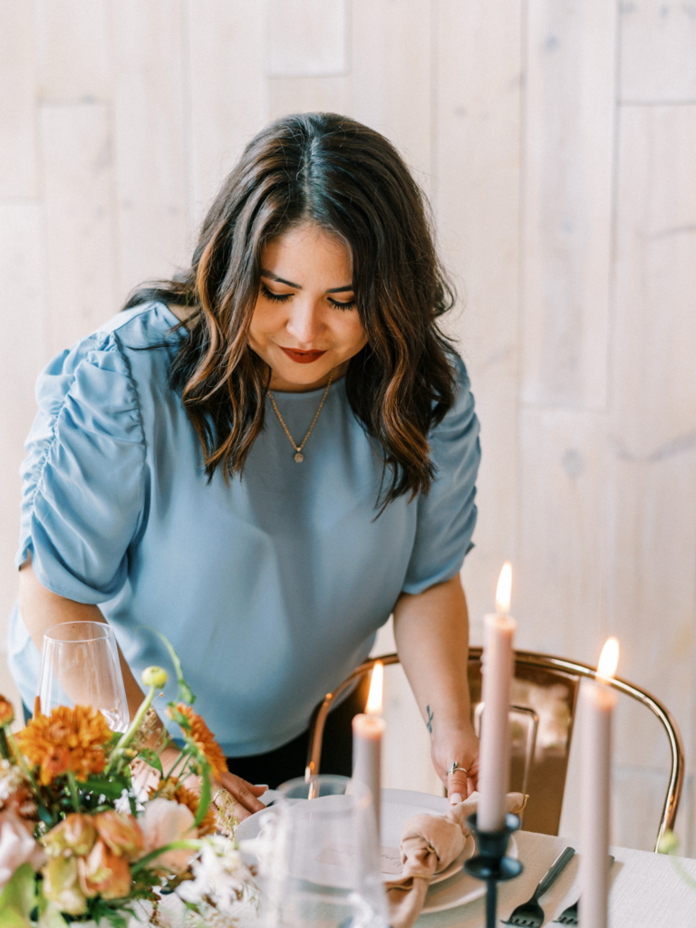 event planner setting table for wedding