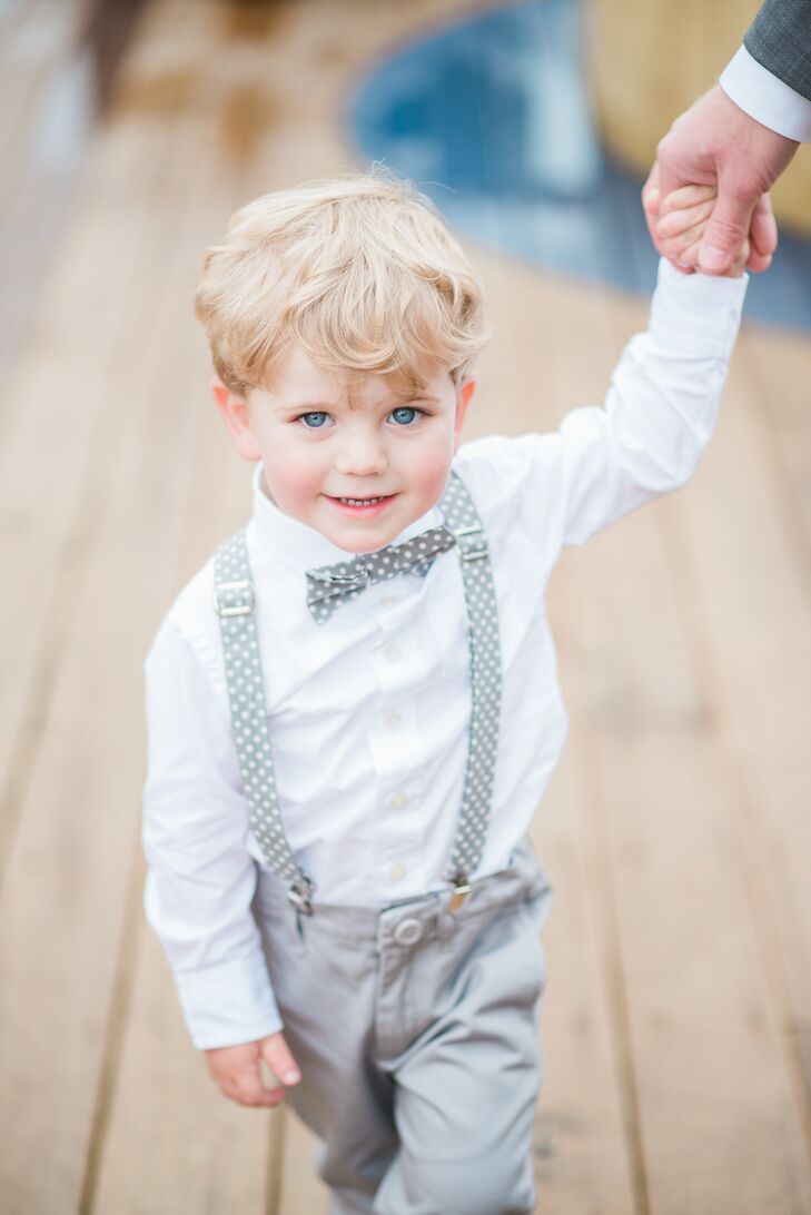 The ring bearers wore gray chinos, white button-downs, gray and white polka-dot suspenders and bow tie, and cognac leather Toms.