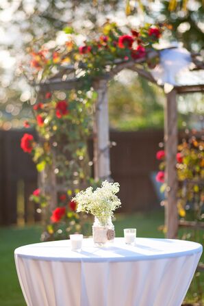 Cocktail Hour Table with Rose Arch Backdrop