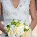 Rebecca carried a classic white, ivory and green bouquet containing roses, calla lilies, hydrangea buds and hypericum berries.