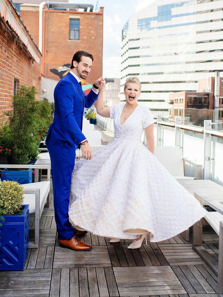 Groom with bride wearing vintage tea-length wedding dress