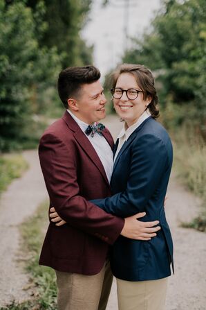 Couple Wearing Colorful Suits Shares Embrace