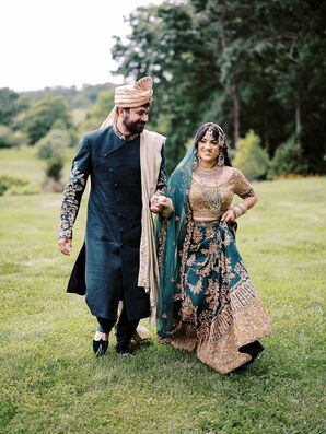 Indian Bride in Emerald and Gold Lehenga With Groom in Kurta and Turban