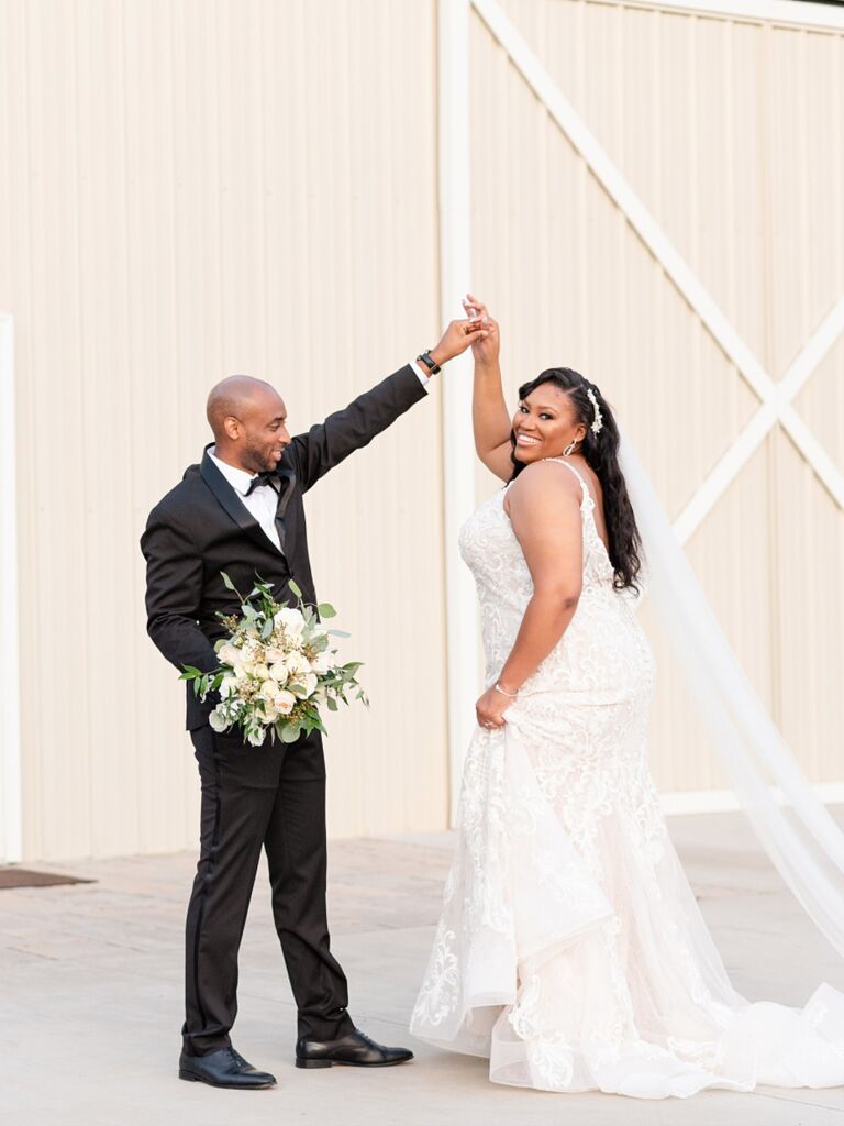Groom twirling bride