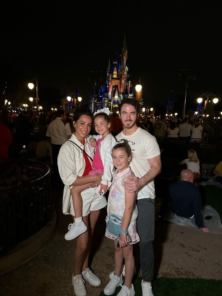 Kevin and Danielle Jonas with their two daughters at Disneyland
