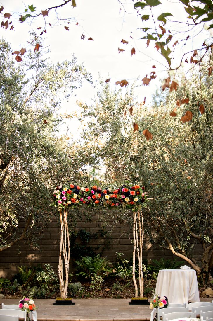 Blossom Floral took Lauren and Phil’s vision for a romantic soiree and ran with it, creating a stunning birch-wood wedding arch for their outdoor garden ceremony. Adorned with a lush rose and ivy garland, the arch provided a striking focal point for the affair, standing out even among the garden’s sea of breathtaking flora.
