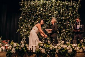 Wedding Vows on Rose Covered Stage at Theater