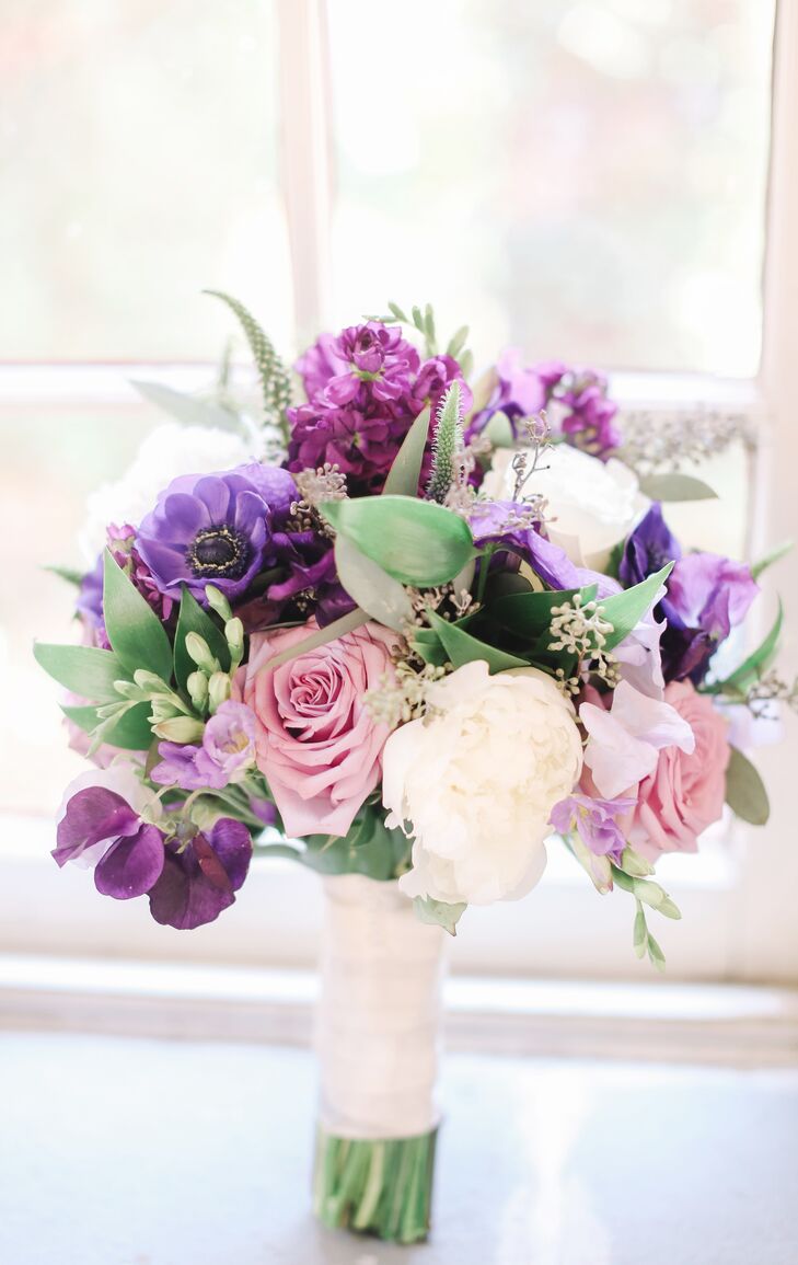 Anne's bridal bouquet included several hues of purple on the classic blooms.