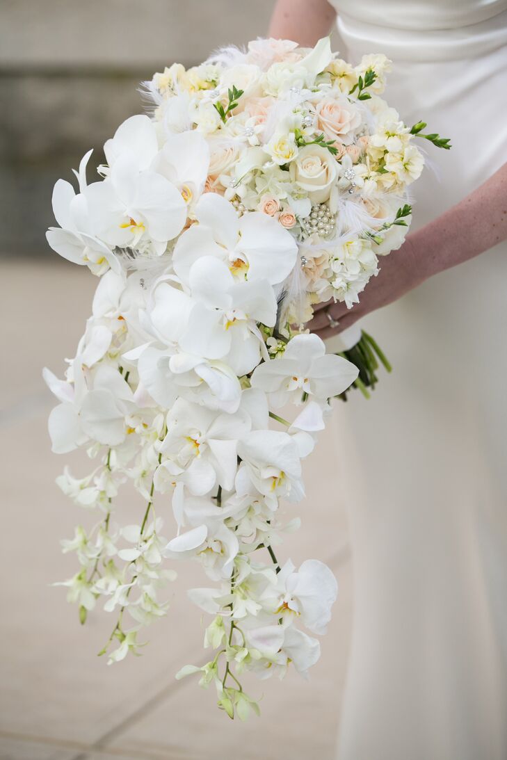 “Since my wedding dress didn’t have a lot of sparkle to it, I wanted to jazz things up a bit with my accessories and bouquet,” Lauren says. Zak Events didn’t disappoint, delivering a stunning cascading arrangement of white calla lilies, garden roses, ranunculus, orchids, freesia and stephanotis wrapped in white silk ribbon and accented with pearl and crystal embellishments. “It was different from anything I’d seen before and also extremely heavy,” Lauren says.