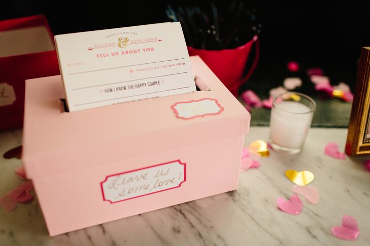 Guests were encouraged to leave notes for the newlyweds in a pink mailbox marked with a heart-shaped red flag. "It now serves as the mailbox in our apartment," Allison says.