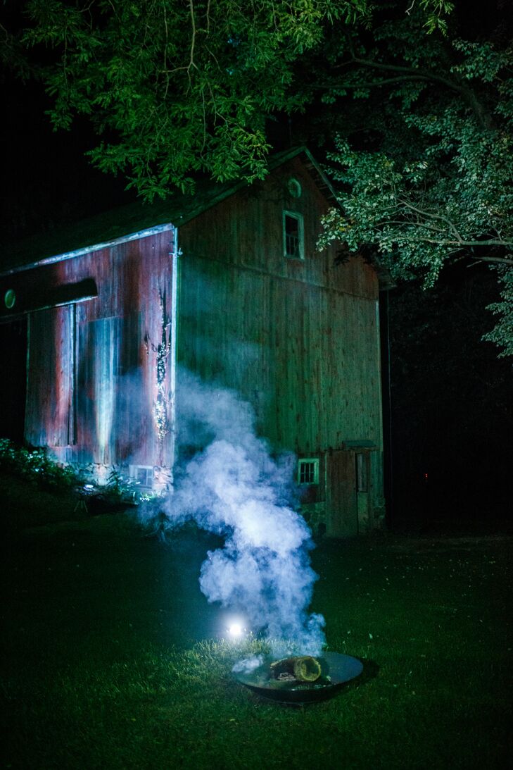 The farmhouse looked stunning at night with soft blue underlighting that helped guests find their way to the dance floor. Several carefully-placed stainless steel firebowls were used for both their ethereal smoke and for keeping mosquitos at bay.