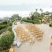 Hotel Balcony Ceremony With Floral, Greenery Arch Overlooking Hotel and Ocean