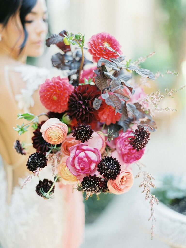 Vibrant bouquet featuring black, pink, and red dahlias. 