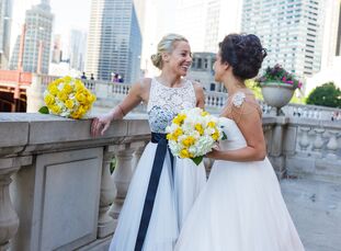 Pink rose petals lined the brick-paved alley where Kylie Grant (32 and a photographer) and Rachael Ford (32 and a salon owner) wed in an intimate cere
