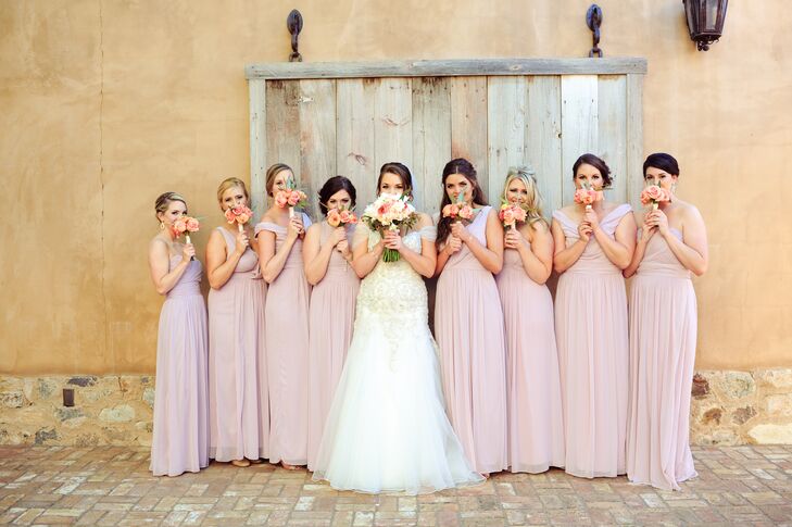 Nicole's bridesmaids chose their own floor-length chiffon dresses by Dessy in Suede Rose, which fit beautifully with the desert backdrop.