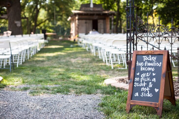 A chalkboard sign announced to guests that they should pick a seat, not a side.