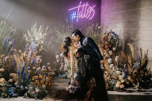 Bride in Black Wedding Dress Kissing Groom in Black Suit