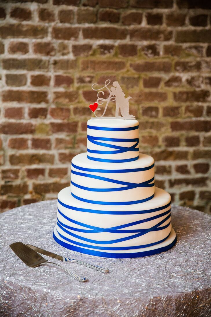 With so many delicious options to choose from, Shayna and Josh couldn’t decide on just one flavor for their modern three-tier wedding cake. “So we decided to go with two!” says Shayna. “The first and third tiers were to-die-for champagne cake and the second tier was a chocolate lover’s chocolate.” Beneath the layers of white and blue fondant was a decadent layer of vanilla buttercream frosting.