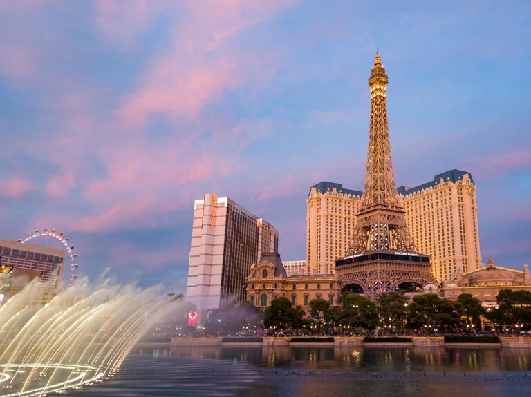 Sunset view of the Paris Casino with Eiffel tower and water dance performance in Las Vegas