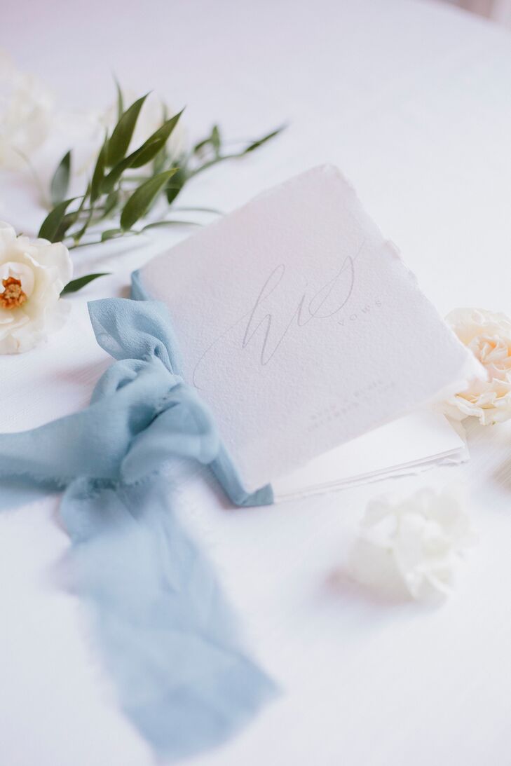 Elegant White Torn-Edge Vow Booklet Tied with Blue Ribbon