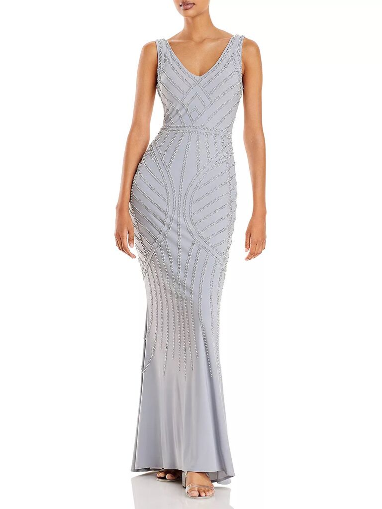Body hugging floor length light blue dress with all over beading