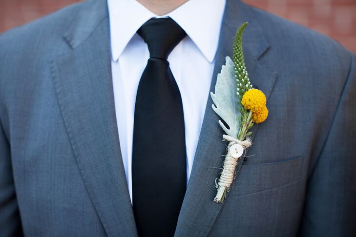 David added a pop of bright color to his cool gray suit with a boutonniere comprised of cheerful yellow craspedias, white veronica and dusty miller.