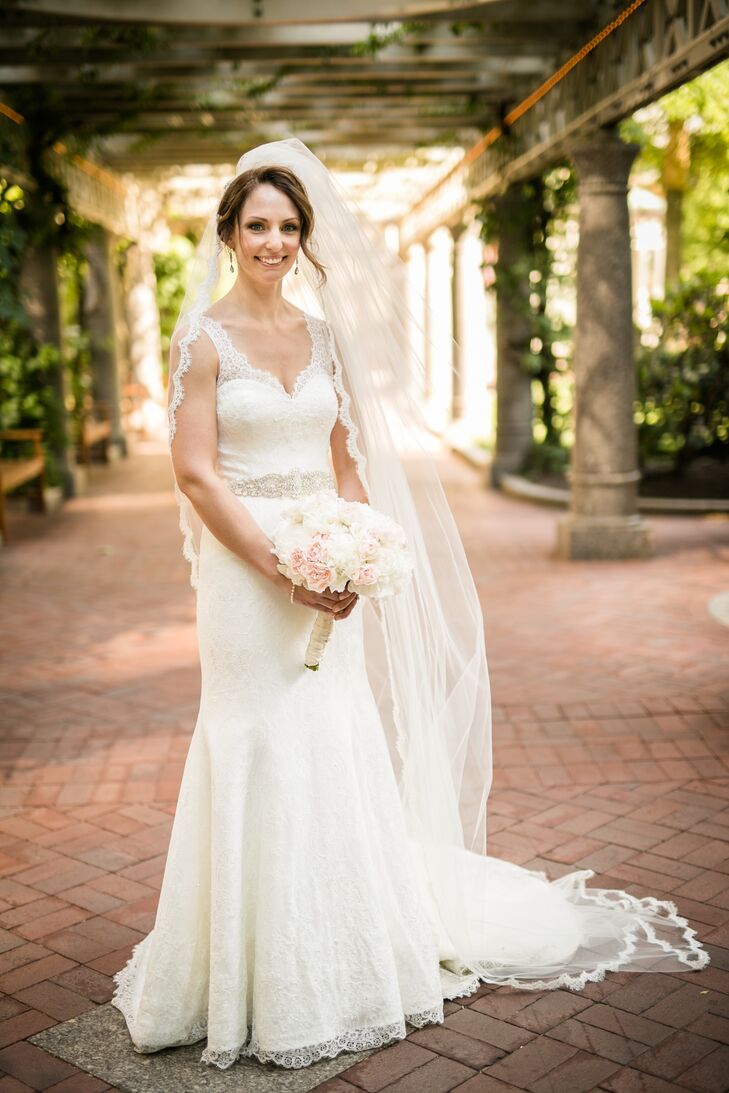 When Rebecca embarked on her mission to find the perfect dress for her classic, formal affair, she had several styles in mind, though they varied significantly. After trying on several gowns at Allegria Bridal in Belmont, Massachusetts, she finally came across one that truly caught her attention—a lace mermaid-style gown by Augusta Jones. To give the gown a touch of personal flair, she had a few alterations made, including the addition of buttons and a keyhole back.