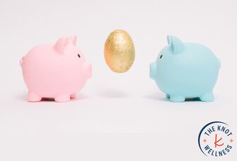 Two piggy banks facing a golden egg
