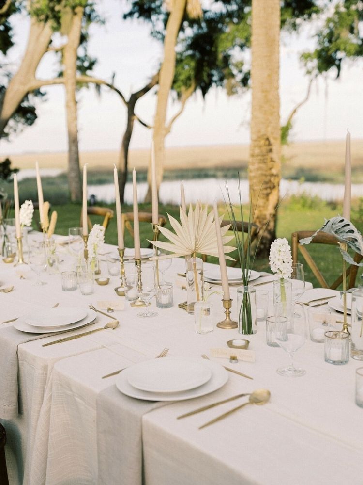 boho tablescape with taupe taper candles and gold candlesticks