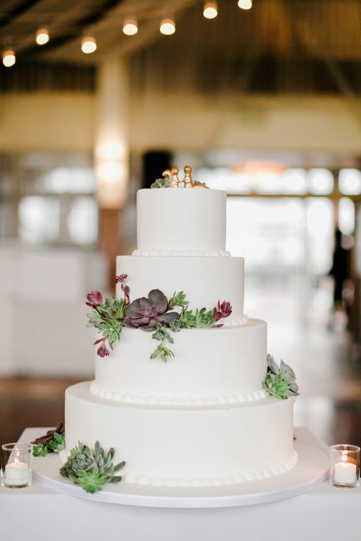 Janel and Charlie also consulted Carlo’s Bakery (known for it’s TV show on TLC, “Cake Boss") for their natural fete. The pastry chefs designed a tiered carrot cake covered in white fondant. Her favorite succulents decorated each layer for a natural touch. Twin gold ceramic squirrels from Etsy.com served as its topper and alluded to the couple’s love for the outdoors.
