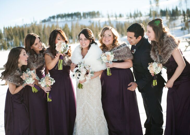 The bridesmaids wore floor-length plum dresses with faux fur stoles to match Kristen’s white fur stole.